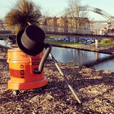 Professional chimney sweep servicing a residential chimney in Runcorn, Cheshire